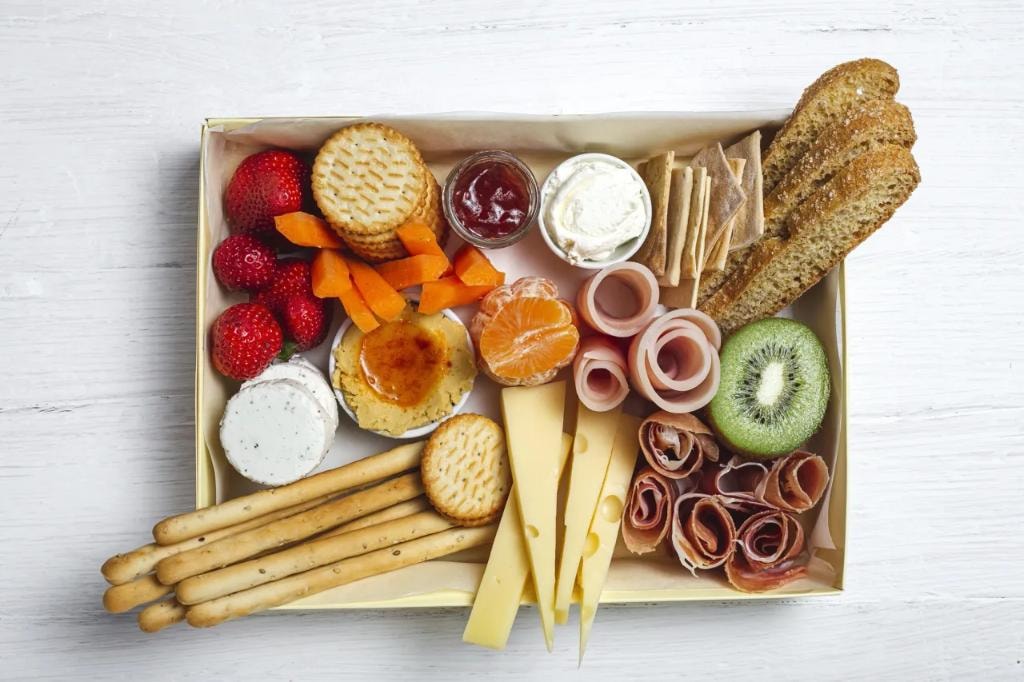 Charcuterie gift box with crackers and fruit